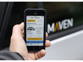 A smartphone displays the Maven app, a General Motors car-sharing service, in Ann Arbor, Mich., on April 27, 2016.
