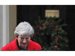 Britain's Prime Minister Theresa May leaves 10 Downing Street to make a statement in Parliament in London, Monday, Dec. 3, 2018.