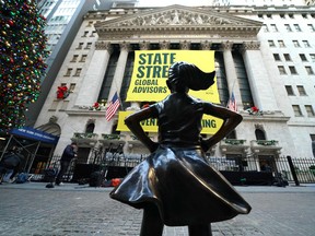 The  Fearless Girl statue is unveiled at her new home facing the New York Stock Exchange Monday.
