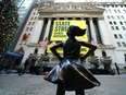The  Fearless Girl statue is unveiled at her new home facing the New York Stock Exchange Monday.