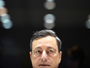 European Central Bank policy makers led by President Mario Draghi confirmed that they'll stop net purchases of bonds this month, ending almost four years of quantitative easing.