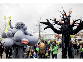 Demonstrators take part in a climate demonstration in Berlin, Germany, Saturday, Dec. 1, 2018. Thousands of people are marching in Berlin and Cologne to demand that Germany make a quick exit from coal-fired energy, a day before a U.N. climate summit opens in neighboring Poland.