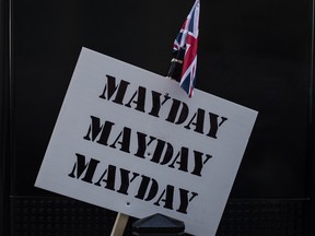 A sign is held up saying 'MayDay' as people take part in a UKIP-backed Brexit betrayal rally on Sunday in London.