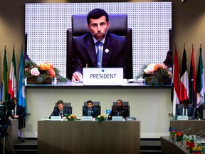 OPEC President UAE Energy Minister Suhail al-Mazrouei, centre, speaks flanked by Minister of Energy of Russia Alexander Novak (left) and OPEC Secretary General Mohammed Sanusi Barkindo (right) of Nigeria during the OPEC meeting Friday in Vienna.