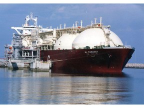 A Qatari liquid natural gas tanker ship being loaded with LNG in Qatar.