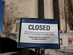 A sign announcing the closure of the National Archives due to a partial government shutdown is displayed in Washington, D.C., U.S., on Thursday, Dec. 27, 2018.