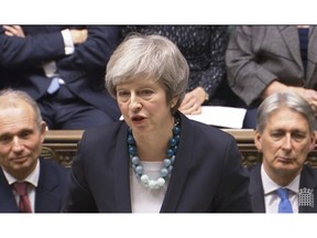 In this grab taken from video, Britain's Prime Minister Theresa May makes a statement in the House of Commons, in London, Monday, Dec.  10, 2018.  May has postponed Parliament's vote on her European Union divorce deal to avoid a shattering defeat _ a decision that throws her Brexit plans into chaos.