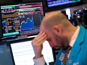 A trader works on the floor of the New York Stock Exchangeon Wednesday, when U.S. stocks careened to a 15-month low. They are at it again today.