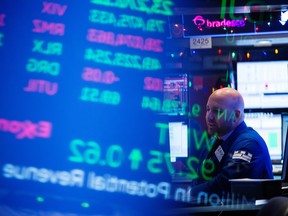 A trader works on the floor of the New York Stock Exchange (NYSE) in New York, U.S., on New Year’s Eve.