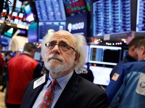 A trader works on the floor of the New York Stock Exchange.