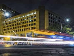 FILE - In this Nov. 1, 2017, file photo, traffic along Pennsylvania Avenue in Washington streaks past the Federal Bureau of Investigation headquarters building. The National Republican Congressional Committee said Tuesday that it was hit with a "cyber intrusion" during the 2018 midterm campaigns and has reported the breach to the FBI.