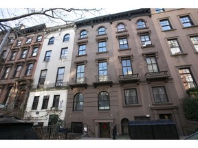 In this Dec. 10, 2018 photo, a brownstone apartment building, center, owned by Kushner Companies is shown in the Brooklyn Heights neighborhood of New York. An Associated Press investigation found President Donald Trump's daughter and son-in law could benefit from a program they pushed that offers massive tax breaks to developers who invest in downtrodden American areas. Ivanka Trump and Jared Kushner own a major stake in a real estate investment firm that recently announced it is launching funds to take advantage of the Opportunity Zone program. Separately, Kushner's family firm owns at least 13 properties that could qualify for the tax breaks because they are in Opportunity Zones in New Jersey, New York and Maryland.
