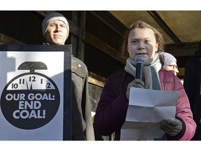 Swedish young activist, 15-year-old Greta Thunberg, right, speaks to climate activists during the March for Climate in a protest against global warming in Katowice, Poland, Saturday, Dec. 8, 2018, as the COP24 UN Climate Change Conference takes place in the city.