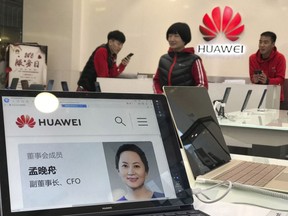 A profile of Huawei's chief financial officer Meng Wanzhou is displayed on a Huawei computer at a Huawei store in Beijing, China, Thursday, Dec. 6, 2018. Canadian authorities said Wednesday that they have arrested Meng for possible extradition to the United States.