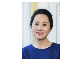 In this undated photo released by Huawei, Huawei's chief financial officer Meng Wanzhou is seen in a portrait photo. China on Thursday, Dec. 6, 2018, demanded Canada release the Huawei Technologies executive who was arrested in a case that adds to technology tensions with Washington and threatens to complicate trade talks. (Huawei via AP)