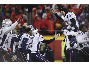 New England Patriots quarterback Tom Brady (12) celebrates with his teammates after the AFC Championship NFL football game, Sunday, Jan. 20, 2019, in Kansas City, Mo.