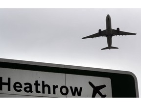 FILE - In this file photo dated Tuesday, June 5, 2018, a plane takes off over a road sign near Heathrow Airport in London. British lawmakers are set to vote Monday June 25, 2018, on whether to expand Europe's biggest airport, Heathrow. Disruptions to air travel are possible if Britain leaves the European Union in March without a deal, the head of the leading association for airlines around the world warned Thursday, Jan. 10, 2019.