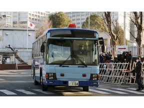 In this Tuesday, Jan. 8, 2019, file photo, a vehicle presumably carrying former Nissan chairman Carlos Ghosn leaves Tokyo Detention Center in Tokyo. Ghosn was getting his day in court to demand the reason for his prolonged detention by Tokyo authorities. The hearing Tuesday would be his first public appearance since his arrest on Nov. 19, 2018.
