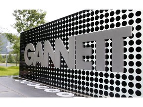 FILE - In this July 14, 2010, file photo, the Gannett Co.headquarters sign stands in McLean, Va. The Wall Street Journal is reporting that MNG Enterprises, better known as Digital First Media, is preparing to bid for newspaper publisher Gannett Co.