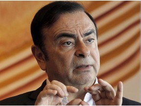 FILE - In this April 20, 2018, file photo, then Nissan Chairman Carlos Ghosn speaks during an interview in Hong Kong. Major Japanese business daily Nikkei is reporting Nissan's former Chairman Carlos Ghosn has reiterated his innocence, saying the payments to a Saudi businessman were legitimate.