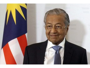 FILE - In this Monday, Jan. 21, 2019, file photo, Malaysia's Prime Minister Mahathir Mohamad arrives for meeting at the federal chancellery in Vienna, Austria. On Tuesday, Jan. 29, 2019, Mahathir says that proceeding with a multi-billion-dollar rail link project backed by China will "impoverish" the country, saddling it with heavy debts for the next 30 years.
