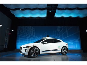 FILE - In this March 27, 2018 file photo, the Jaguar I-Pace vehicle outfitted with Waymo's suite of sensors and radar is introduced in New York. Google's self-driving car spinoff Waymo said Tuesday it will bring a factory to Michigan, creating up to 400 jobs at what it describes as the world's first plant "100 percent" dedicated to the mass production of autonomous vehicles.
