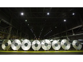 Rolls of coiled coated steel are shown at Stelco in Hamilton, Ont. on June 29, 2018. Statistics Canada says the country's merchandise trade deficit with the world increased to $2.1 billion in November compared with $851 million in October.THE CANADIAN PRESS/Peter Power