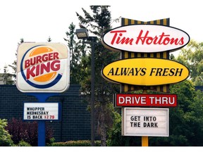 Burger King and Tim Hortons' parent Restaurant Brands International Inc. raised its dividend as it announced changes in its executive suite.