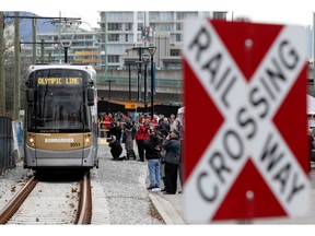 A Bombardier Olympic Line train departs from near the Olympic Village Canada Line Station in Vancouver, B.C., on Thursday, January 21, 2010. Bombardier Inc. has signed a US$669-million contract to provide 113 commuter rail cars to New Jersey.