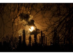 A flare stack lights the sky from the Imperial Oil refinery in Edmonton on Friday December 28, 2018. Financial analysts say fourth-quarter results from Canada's biggest oil and gas companies will likely feature some surprises, as well as revisions to forward plans, given extreme volatility in commodity prices in the last three months of 2018.