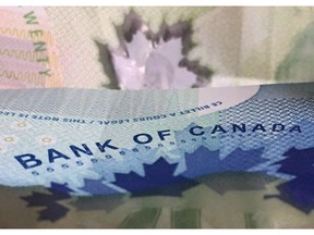 Canadian bank notes are seen in Ottawa on Wednesday, September 6, 2017. Rising interest rates appear to be taking a toll on Canadians' finances as the total number of insolvencies filed under the Bankruptcy and Insolvency Act increased by 5.2 per cent in November from the prior year.