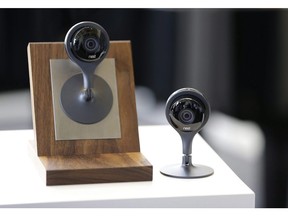 Nest Cam surveillance video cameras are on display following a news conference Wednesday, June 17, 2015, in San Francisco. Canadian businessman Gordon Flatt has filed a lawsuit in a U.S. court to find out who is behind three hidden video cameras he discovered in an apartment he uses in New York.