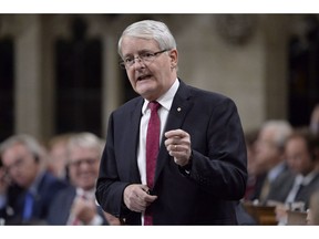 Transportation Minister Marc Garneau responds during question period in the House of Commons on Parliament Hill in Ottawa on October 23, 2018. The country's transportation ministers have agreed to develop an entry-level training standard for semi-truck drivers nationwide. Federal Transport Minister Marc Garneau says the minimum bar to get behind the wheel of a semi truck will ensure drivers have the necessary skills, and will be in place by January 2020.
