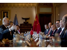 US Trade Representative Robert Lighthizer, right, accompanied by Trump Administration officials, meets with Chinese Vice Premier Liu He, left, and other Chinese officials as they begin US-China Trade Talks in the Diplomatic Room of the Eisenhower Executive Office Building on the White House Complex, Wednesday, Jan. 30, 2019, in Washington.