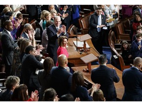 House Democratic Leader Nancy Pelosi of California, who is expected to lead the 116th Congress as speaker of the House, is applauded at the Capitol in Washington, Thursday, Jan. 3, 2019.