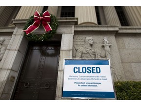 A closed sign is displayed at The National Archives entrance in Washington, Tuesday, Jan. 1, 2019, as a partial government shutdown stretches into its third week. A high-stakes move to reopen the government will be the first big battle between Nancy Pelosi and President Donald Trump as Democrats come into control of the House.