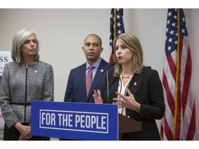 From left, Democratic Caucus Vice Chairman Rep. Katherine Clark, D-Mass., Democratic Caucus Chairman Rep. Hakeem Jeffries of N.Y., and Democratic Freshman Leadership Representative Katie Hill, D-Calif., speak to reporters about the partial government shutdown following a Democratic strategy session on Capitol Hill in Washington, Tuesday, Jan. 15, 2019.
