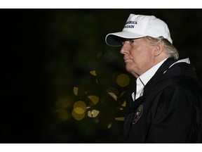 President Donald Trump walks on the South Lawn of the White House in Washington, Thursday, Jan. 10, 2019, after returning from a trip to the southern border.