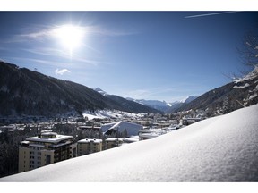 The sun shines as buildings are covered with snow in Davos, Switzerland, Tuesday, Jan. 15, 2019. The World Economic Forum will take place in Davos from Jan. 22, 2019 until Jan. 25, 2019.