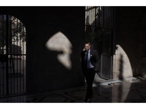 In this Thursday, Jan. 10, 2019 photo, Catalan regional president Quim Torra walks at the Palace of Generalitat or Catalan government headquarters, ahead of an interview with The Associated Press, in Barcelona, Spain. Catalonia separatist leader says that the Spanish government's bid to pass a national budget is doomed unless the wealthy northeastern region is allowed to hold a referendum on secession from the rest of the country.