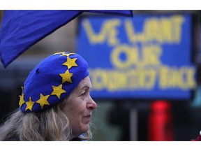 A pro-European demonstrator protests outside parliament in London, Friday, Jan. 11, 2019. Britain's Prime Minister Theresa May is struggling to win support for her Brexit deal in Parliament. Lawmakers are due to vote on the agreement Tuesday, and all signs suggest they will reject it, adding uncertainty to Brexit less than three months before Britain is due to leave the EU on March 29.