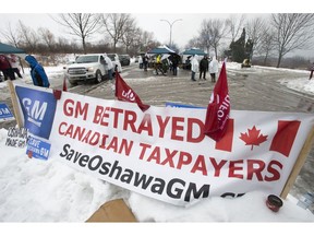 Unifor members engage in an action at General Motors headquarters in Oshawa, Ont., on Wednesday, January 23, 2019. GM plans to close production in Oshawa.