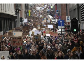 Thousands of youngsters crowd the streets as they march during a climate change protest in Brussels, Thursday, Jan. 31, 2019. Thousands of teenagers in Belgium have skipped school for the fourth week in a row in an attempt to push authorities into providing better protection for the world's climate.