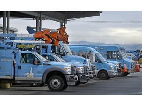 FILE - In this Jan. 14, 2019 file photo, Pacific Gas & Electric vehicles are parked at the PG&E Oakland Service Center in Oakland, Calif. U.S. prosecutors are urging a federal judge to work with a court-appointed monitor to determine ways Pacific Gas & Electric Co. can prevent its equipment from starting more wildfires. In a court filing Wednesday, Jan. 23, 2019, the U.S. attorney's office in San Francisco said Judge William Alsup should refrain from immediately imposing new requirements on the utility.