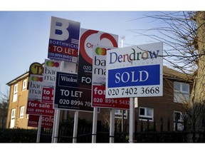 Estate Agent boards stand outside properties in London, Friday,  Jan. 4, 2019. A raft of economic figures released Friday showed the British economy weakening at the turn of the year just as Prime Minister Theresa May delayed a parliamentary vote on the Brexit deal she agreed on with the EU. House prices are down and business optimism in the key services sector is at its second-weakest level since the global financial crisis a decade ago.