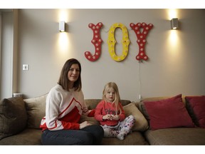 In this Wednesday, Jan. 23, 2019 photo, Victoria Mickleburgh and her daughter Grace pose for photographs at their home in Cobham on the outskirts of south west London. Things are already tough for  Mickleburgh, whose 3-year-old daughter Grace, has Type 1 diabetes and needs insulin daily.  Drug supplies are already stretched because of market forces that have little to do with Brexit. Now pharmacists are concerned that shortages of life-saving medicines may occur if Britain can't negotiate a divorce deal.