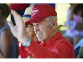 In this July 7, 2018 photo, Herb Teichman waves to the crowd during the 45th Annual International Cherry Pit-Spitting Championship at Tree-Mendus Fruit Farm in Eau Claire, Mich. Teichman, a lifelong Eau Claire fruit farmer and founder of the pit spitting championship died Monday, Jan. 14, 2019, at a Stevensville, Mich., hospice care facility. He was 88.