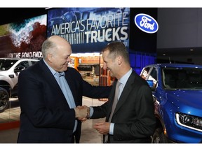 Ford Motor Co. President and CEO, Jim Hackett, left, meets with Dr. Herbert Diess, CEO of Volkswagen AG, Monday, Jan. 14, 2019, at the North American International Auto Show in Detroit.