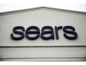 FILE - This Oct. 15, 2018 file photo shows a sign for a Sears Outlet department store is displayed in Norristown, Pa.  Multiple media outlets reported early Wednesday, Jan. 16, 2019, that billionaire Eddie Lampert has won a bankruptcy auction after strengthening his bid in several days of negotiations with creditors. Lampert, Sears' chairman and largest shareholder, upped his offer to more than $5 billion and added a $120 million cash deposit through an affiliate of his ESL hedge fund.