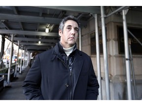 FILE - In this Dec. 7, 2018 file photo, Michael Cohen, former lawyer to President Donald Trump, leaves his apartment building in New York.  Cohen is acknowledging that he paid a technology company to falsely improve Trump's standing in two online polls.